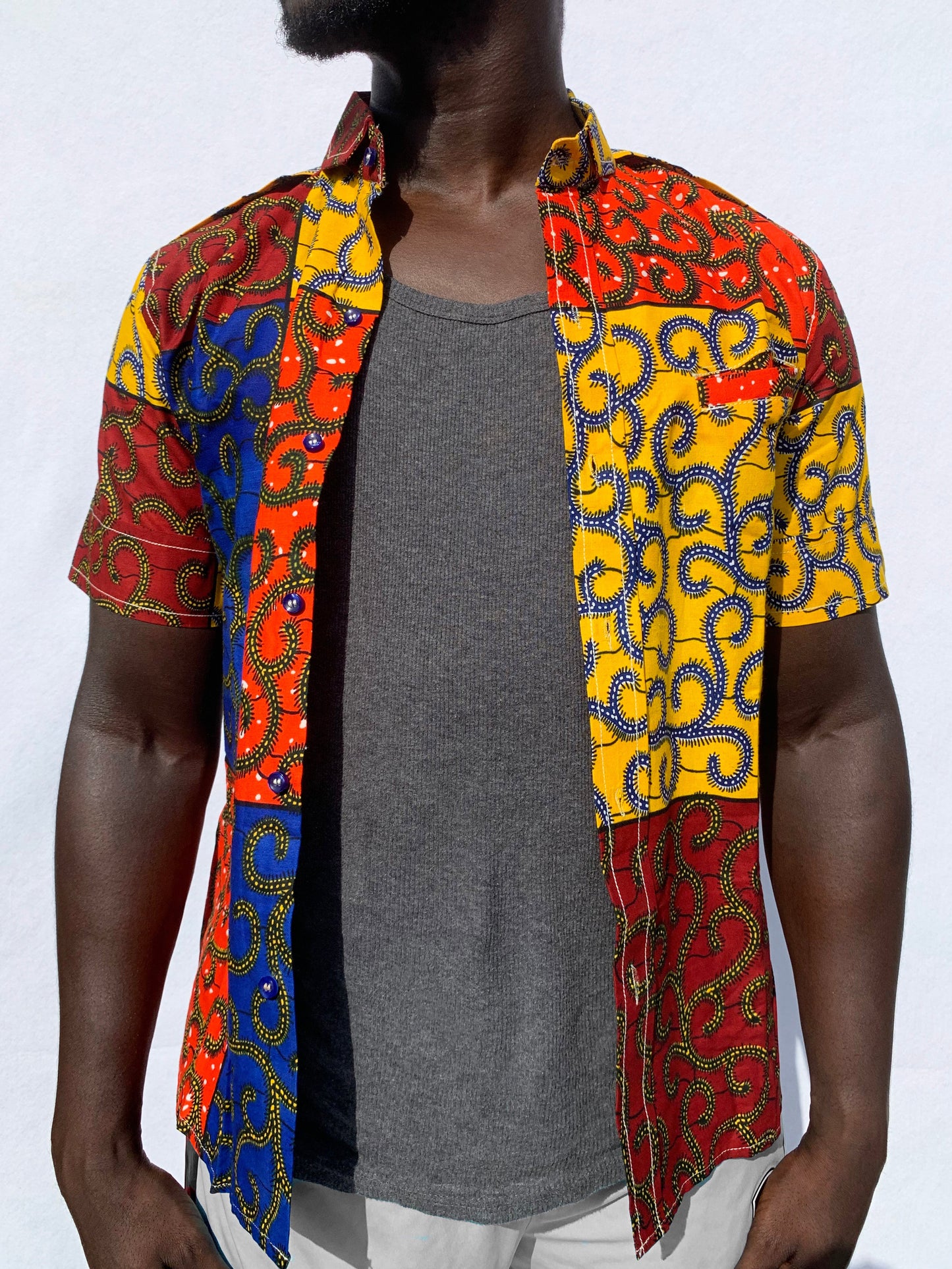 Multicoloured patchwork ankara wax print short sleeve shirt with front pocket