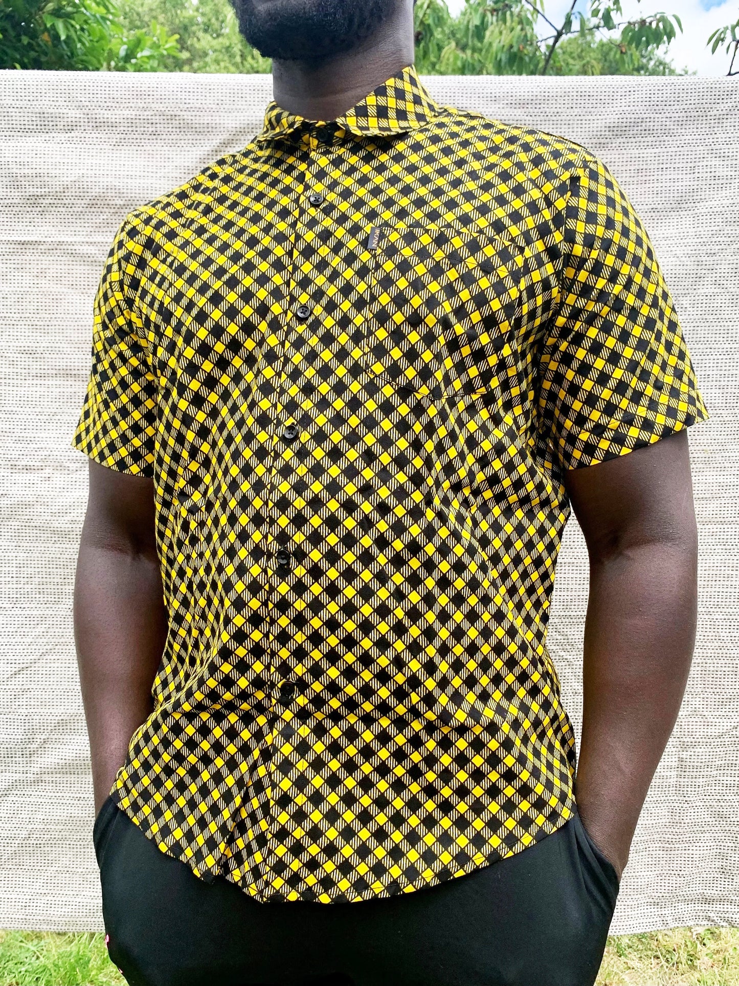 Black & yellow check pattern wax print short sleeve buttoned shirt with front pocket