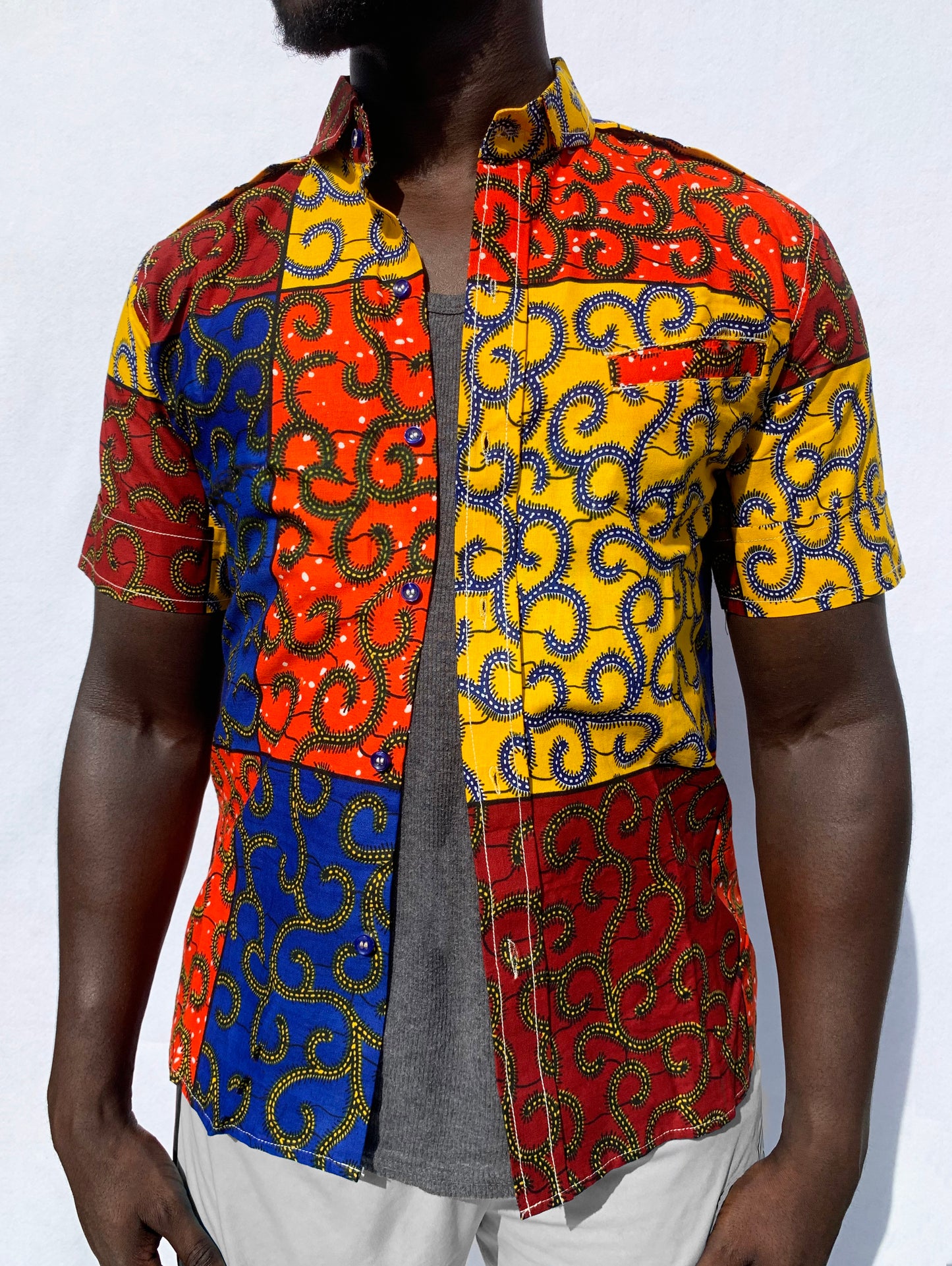 Multicoloured patchwork ankara wax print short sleeve shirt with front pocket