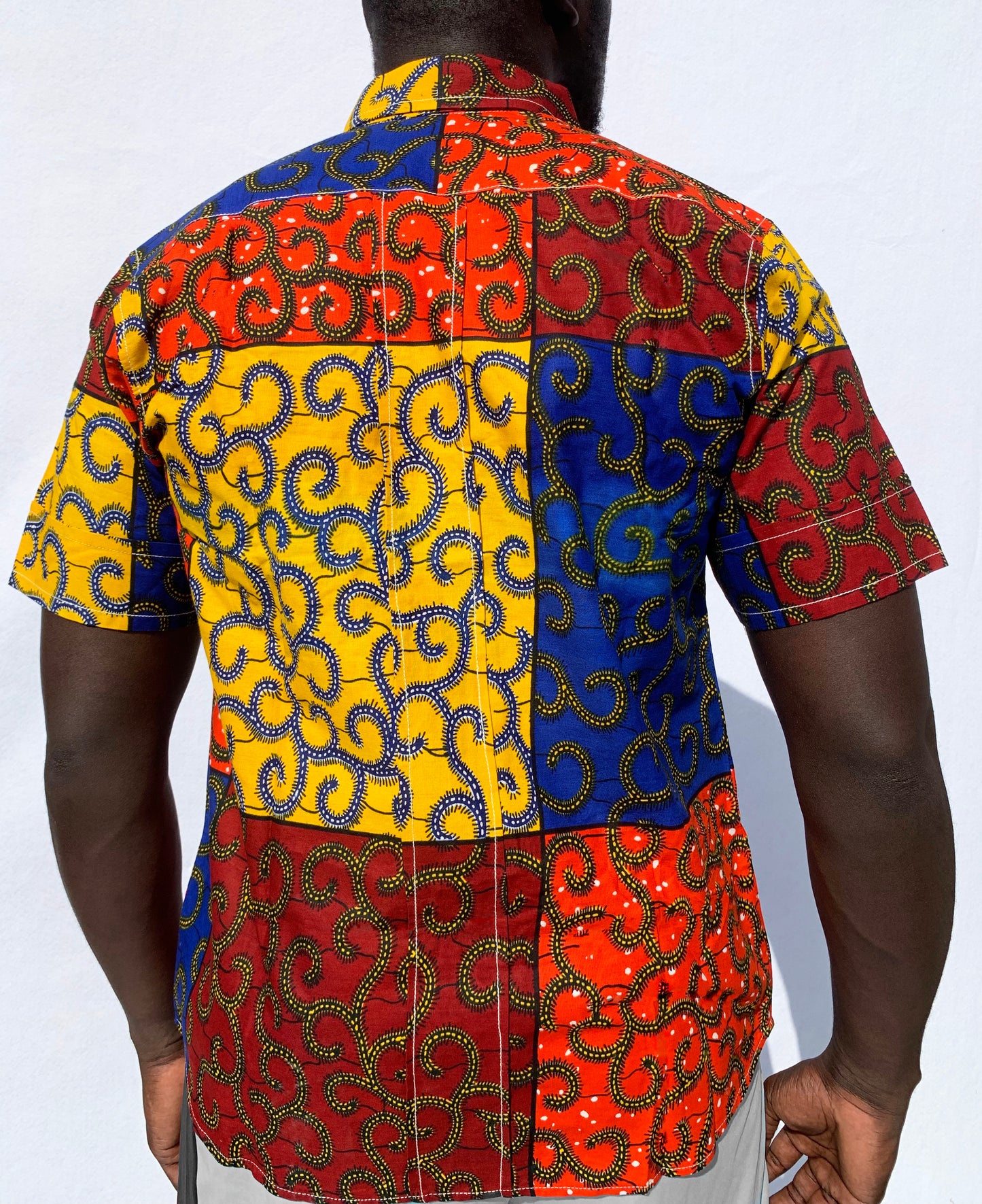 Multicoloured patchwork ankara wax print short sleeve shirt with front pocket