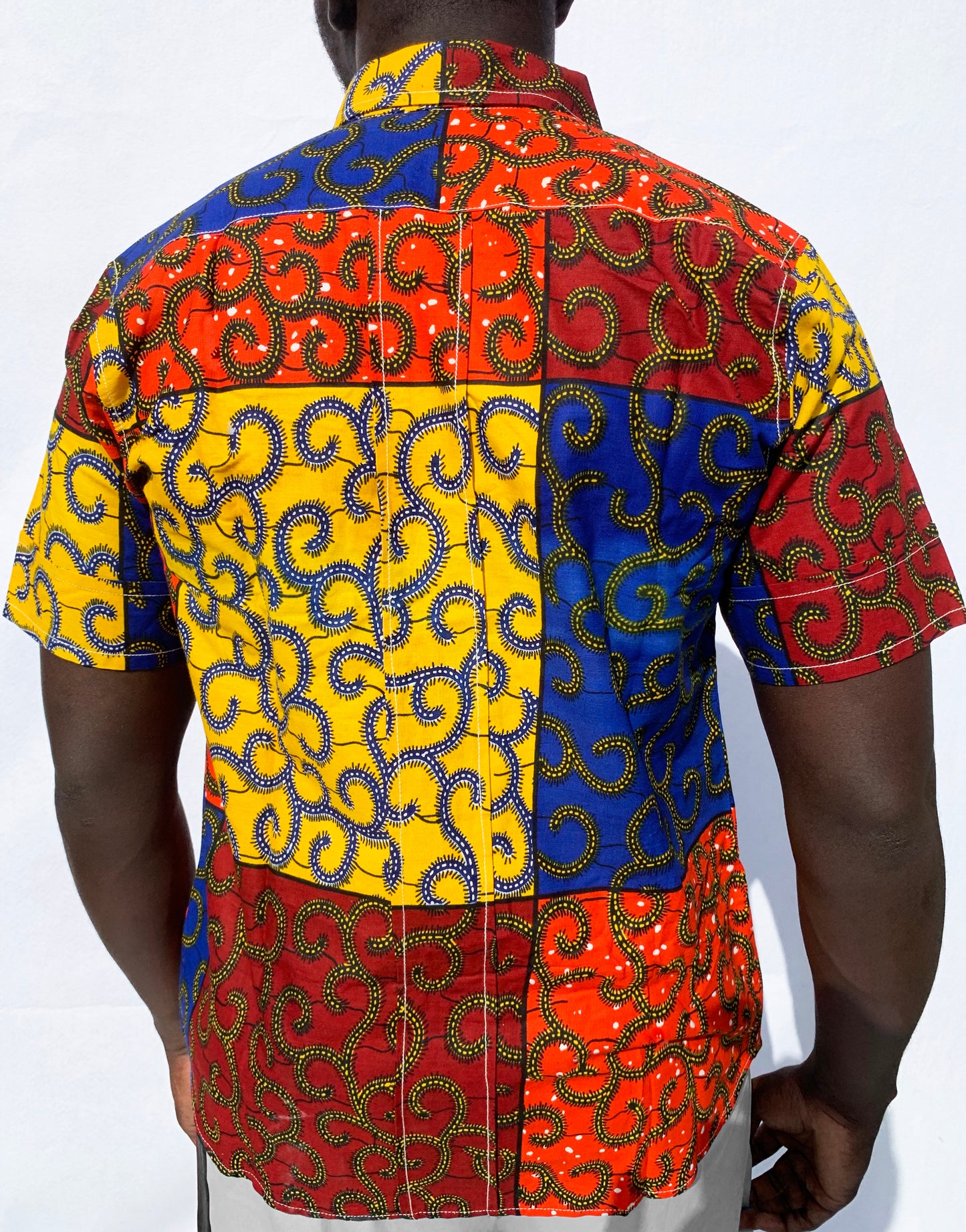 Multicoloured patchwork ankara wax print short sleeve shirt with front pocket