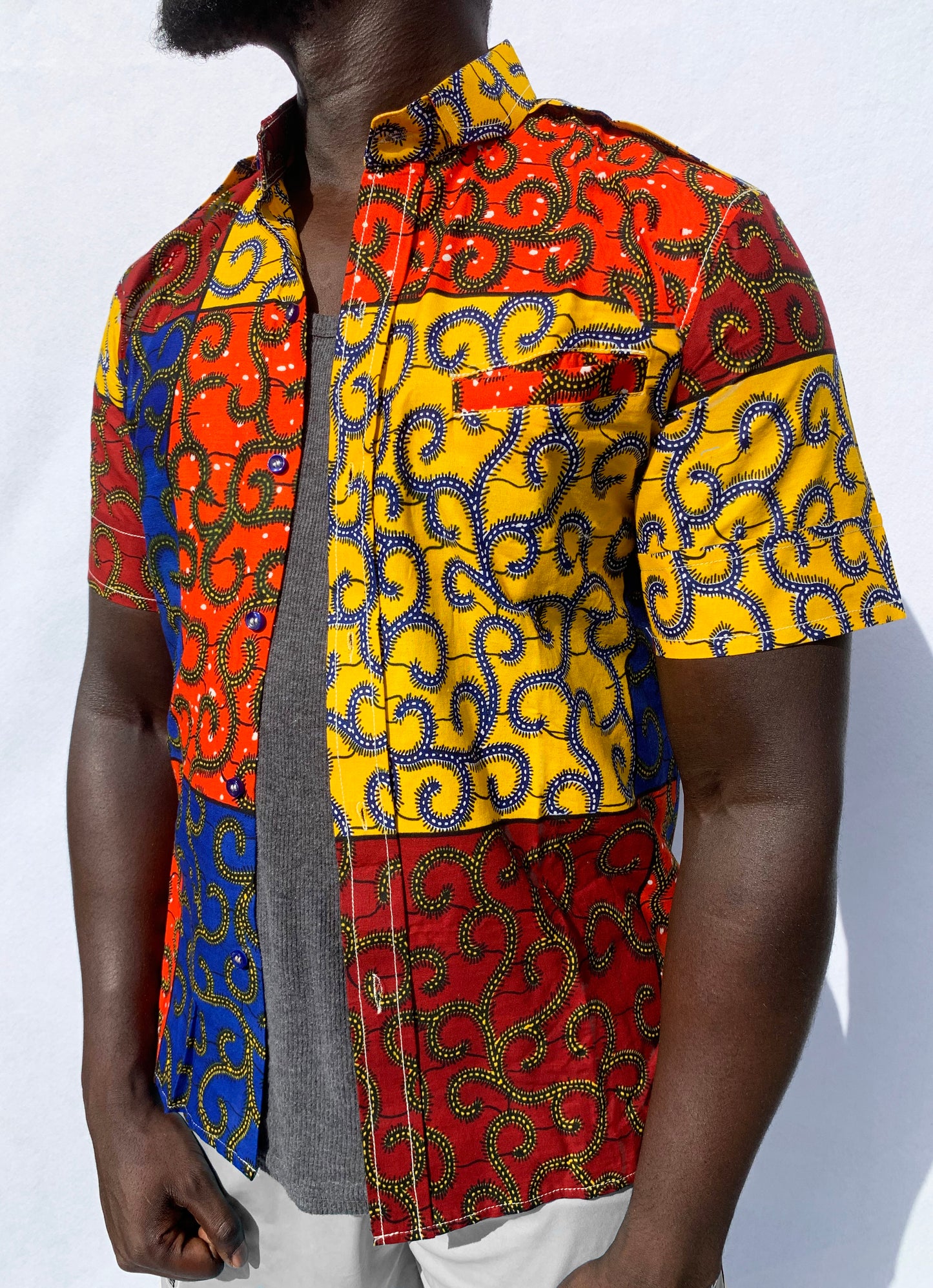 Multicoloured patchwork ankara wax print short sleeve shirt with front pocket